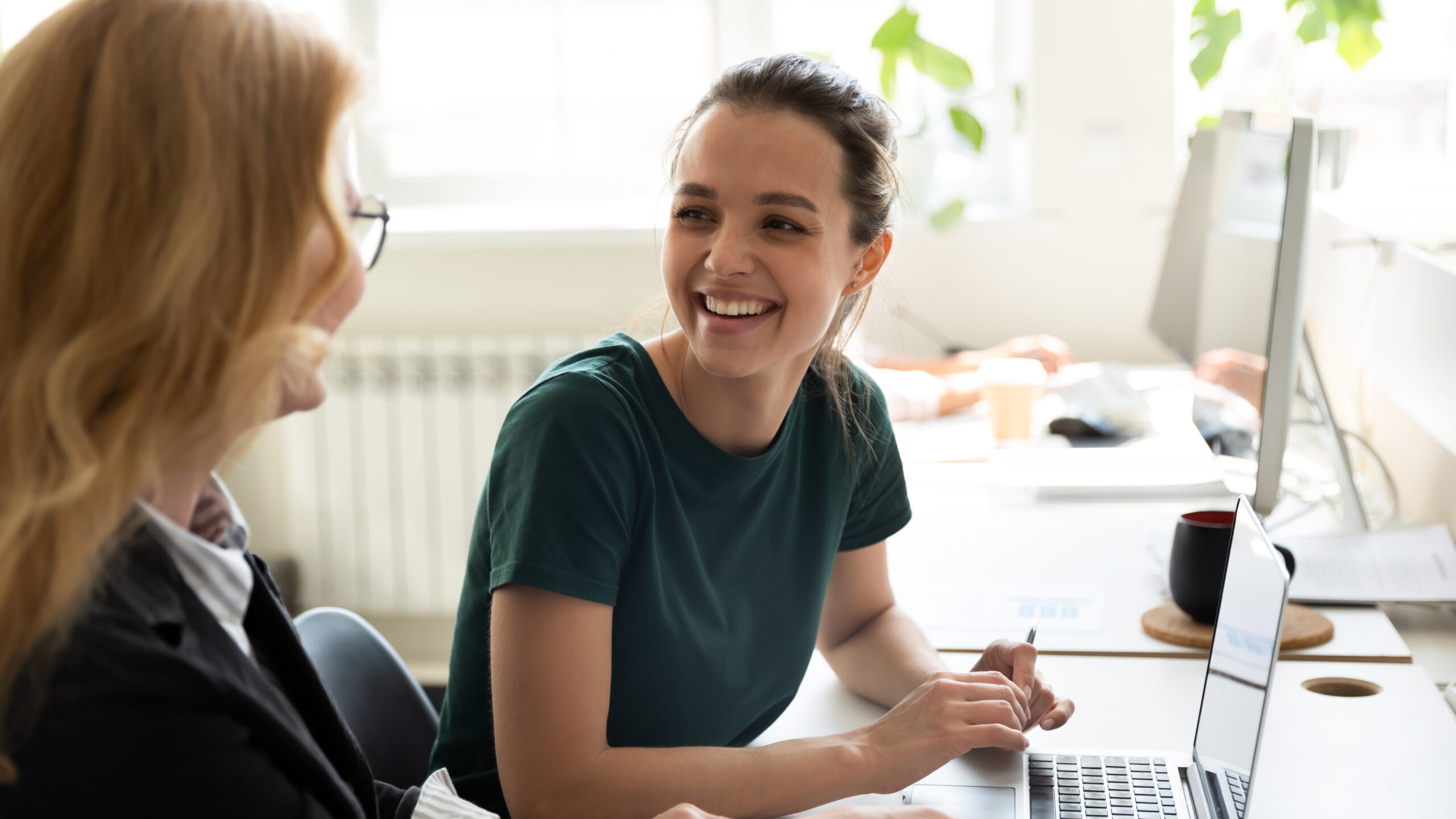 manager teaching an intern some networking tips